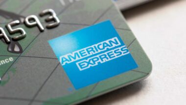 Close up of American Express logo seen on a credit card, representing the AmEx class action.