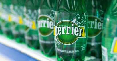 Close up of Perrier water bottles on a supermarket shelf, representing the Perrier class action.