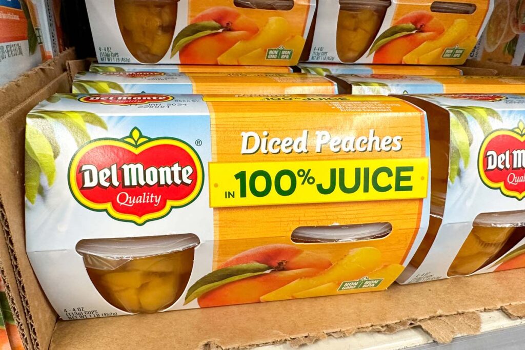 Close up of Del Monte diced peaches on a supermarket shelf, representing the Del Monte class action.