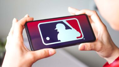 Close up of MLB logo displayed on a smartphone screen, representing the MLB privacy class action lawsuit.