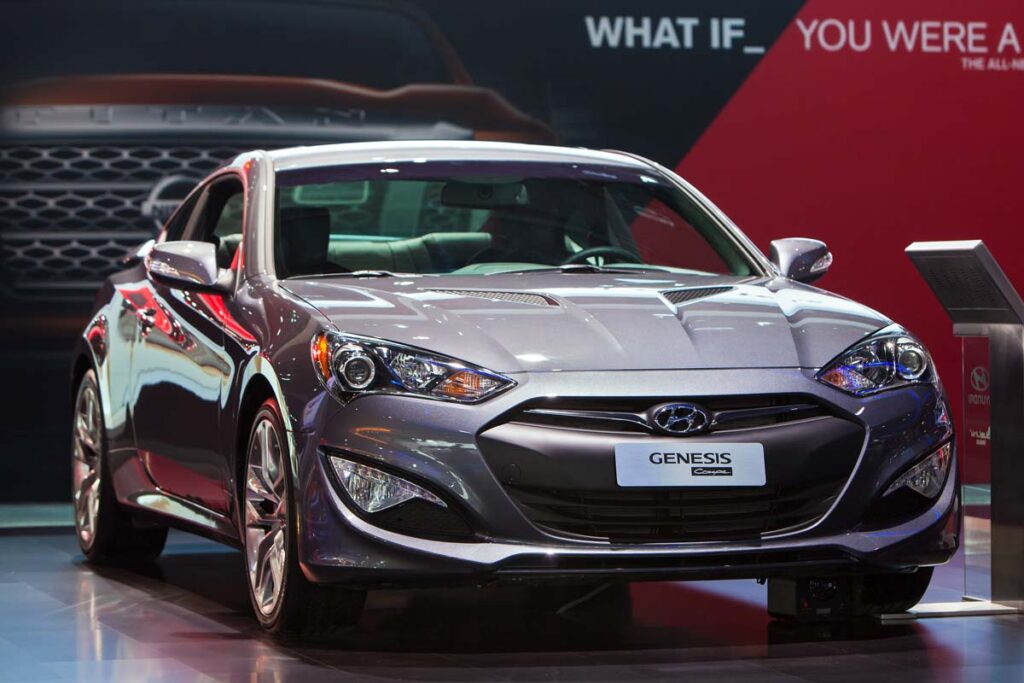 A silver Hyundai Genesis on display at a car show, representing the Hyundai class action.