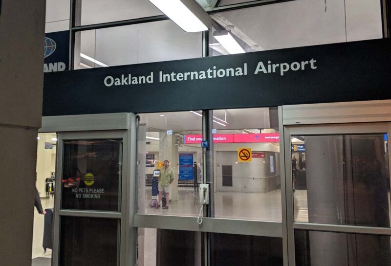 Close up of Oakland International Airport entrance, representing the potential Oakland airport name change.