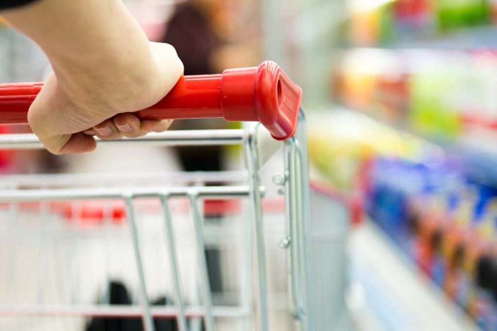 Close up of woman pushing a shopping cart, representing top recalls for the week of April 8.