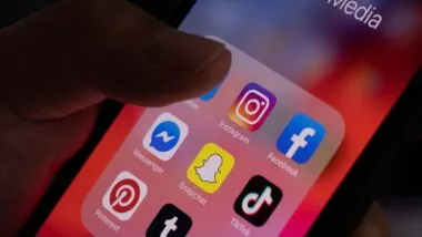 Close up of various social media apps displayed on a smartphone screen, representing the Native Americans social media lawsuit.