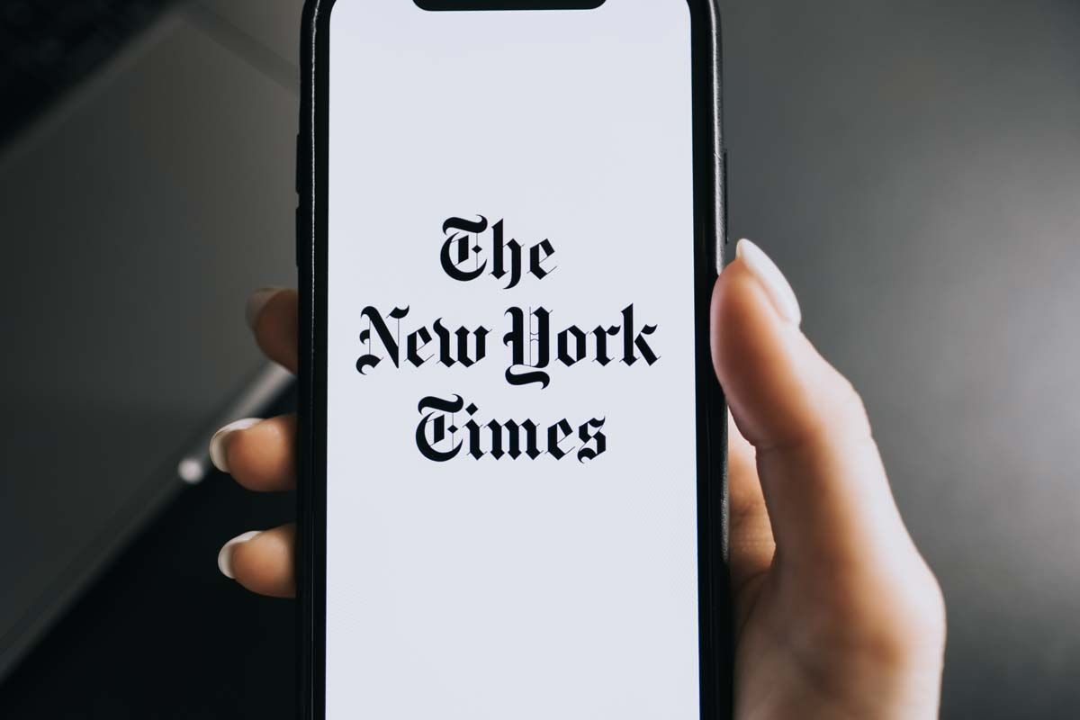 Close up of the New York Times logo displayed on a smartphone screen, representing New York Times subscriber class action.