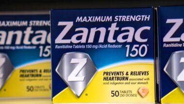 Close up of Zantac products on a supermarket shelf, representing the Zantac cancer settlement.