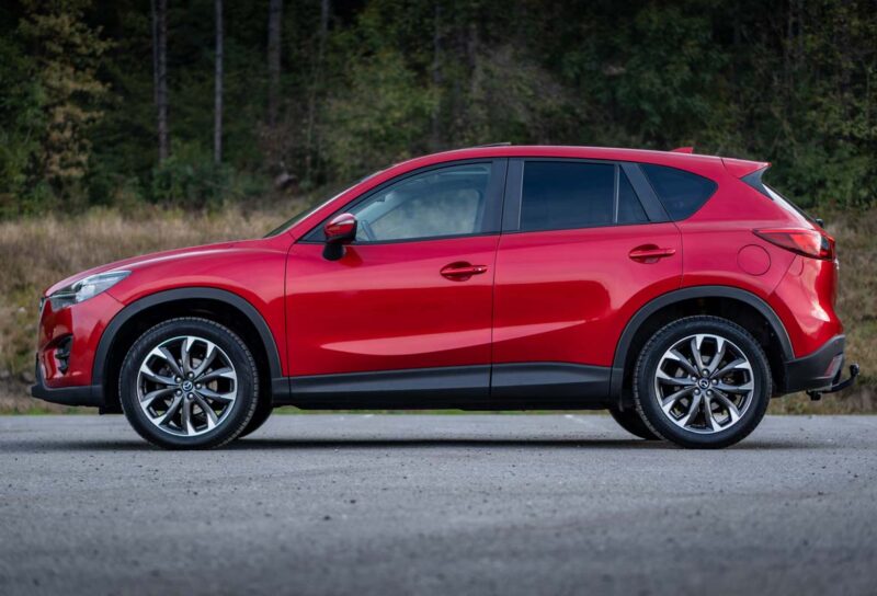 Side view of a 2020 red Mazda CX-5, representing the Mazda class action.