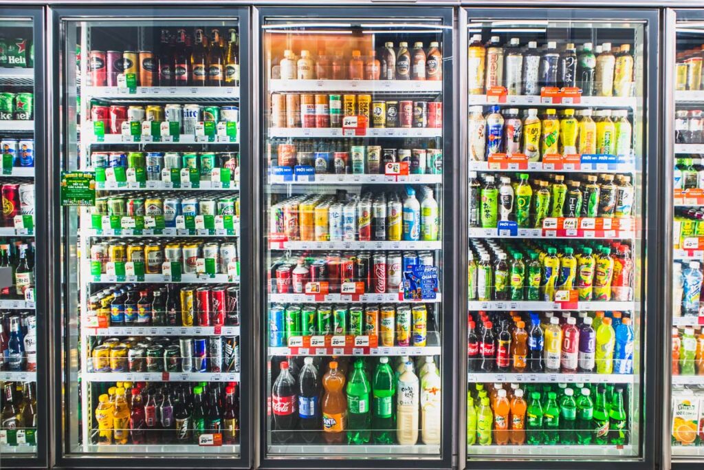 Stocked drinks in supermarket refrigerators, representing the beverage class actions.