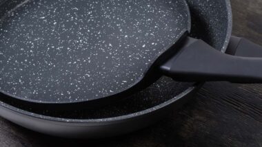 Close up of two frying pans, representing the Brooklyn Steel class action.