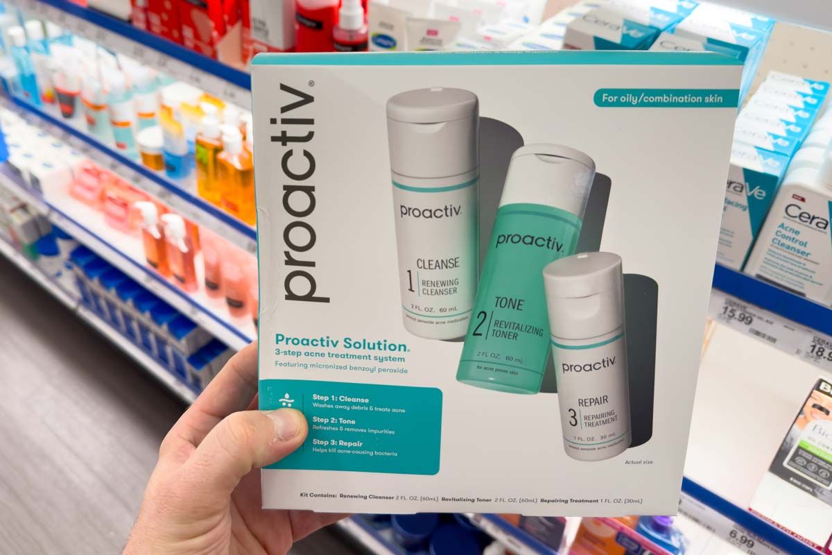 Close up of a woman holding a Proactiv product kit, representing the Proactiv class action.