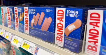 Close up of Johnson & Johnson band aid products on a supermarket shelf, representing the Band-Aid class action.