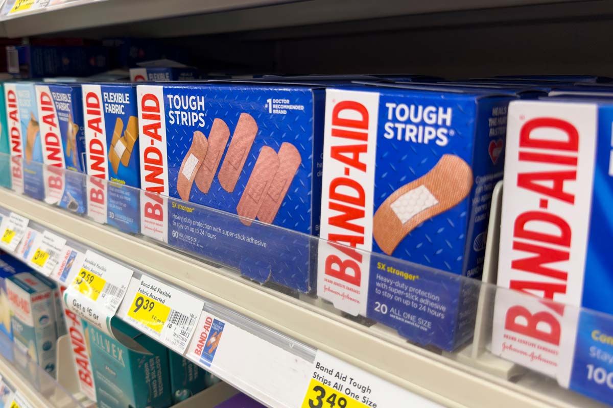 Close up of Johnson & Johnson band aid products on a supermarket shelf, representing the Band-Aid class action.