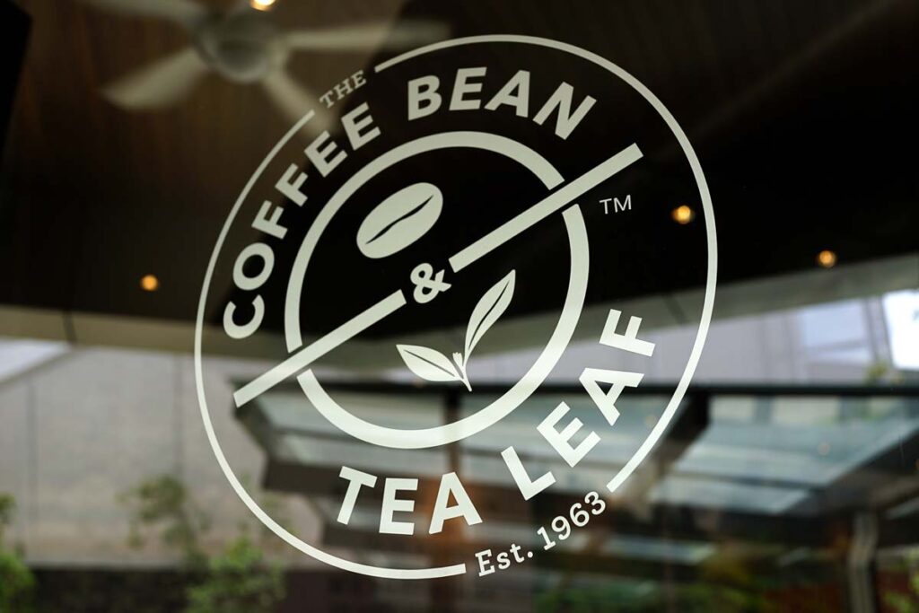 Close up of The Coffee Bean Tea & Leaf window decal, representing the Coffee Bean class action.