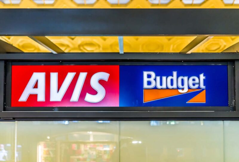 Close up of Avis Budget signage, representing the Avis class action.