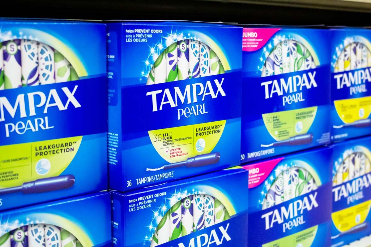Tampax products on a supermarket shelf, representing the Tampax class action.