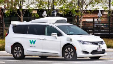 A Waymo car on the road, representing the Waymo and Zoox safety investigations.
