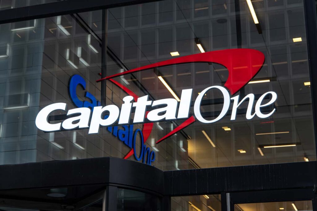 Close up of illuminated Capital One signage at night, representing the Capital One class action.