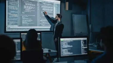 An instructor teaching an IT class, representing the Smoothstack lawsuit.