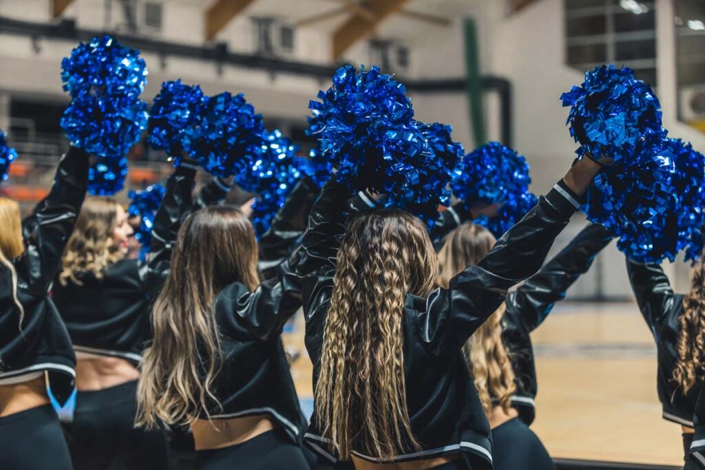 A group of girls at a cheerleading competition, representing the Varsity Brands cheerleading antitrust lawsuit.