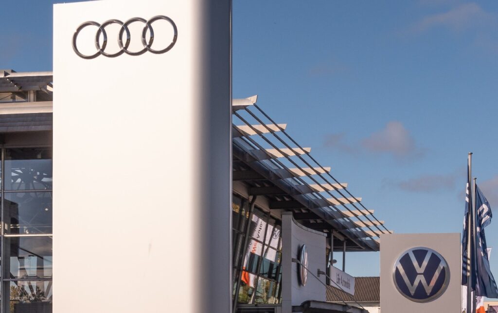 Audi and Volkwagen signs at dealer.