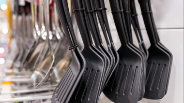 Spatulas hanging in grocery store.