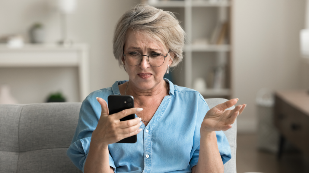 Woman upset at spam texts.