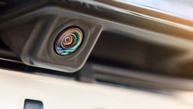 Close up of a rear view camera on the back of a vehicle, representing the Stellantis recalls.
