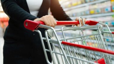 Close up of a woman pushing a shopping cart, representing top recalls for the week of May 27.