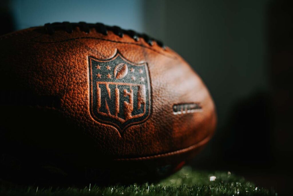 Close up of NFL logo on a football, representing the DirecTV Sunday Ticket.