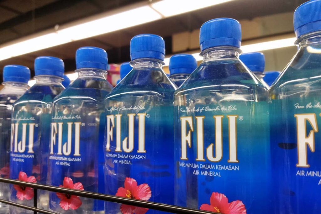 Fiji water bottles on display at a supermarket, representing the Fiji water recall.
