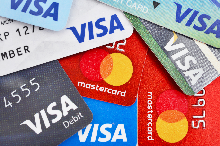 VISA's and mastercard's in loose pile.