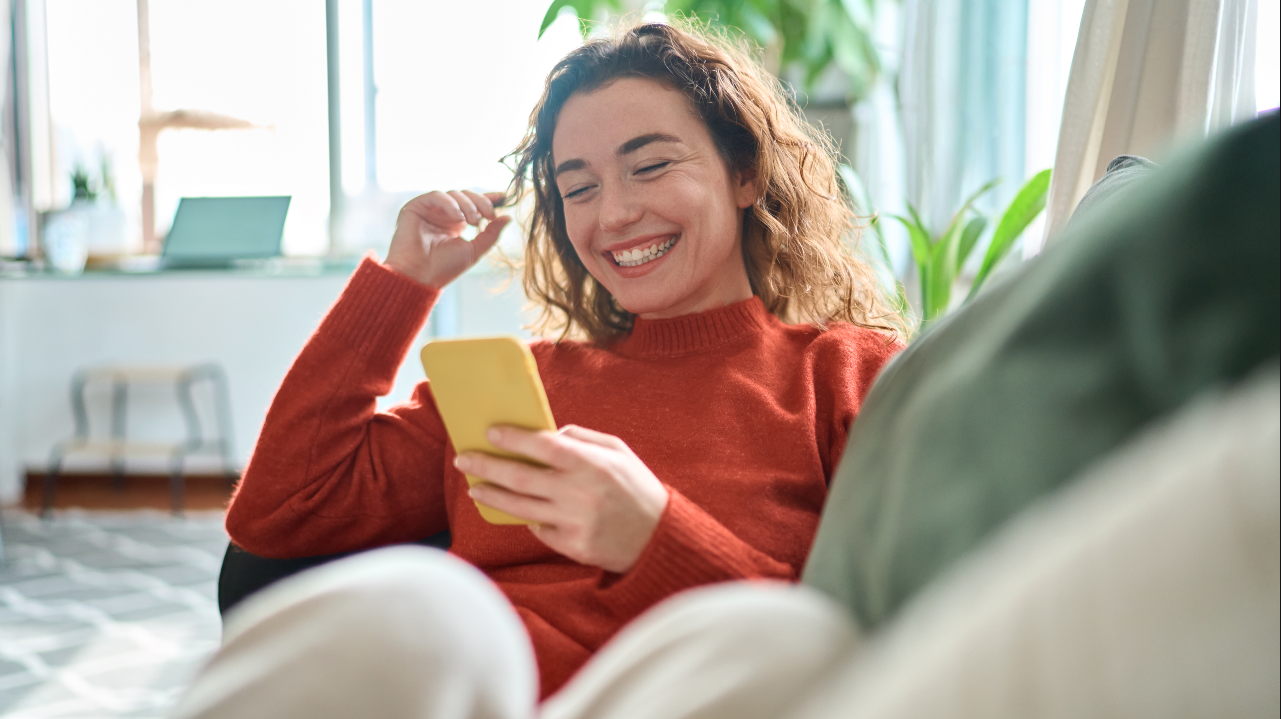 Woman flirting on dating app, representing the Bumble settlement.