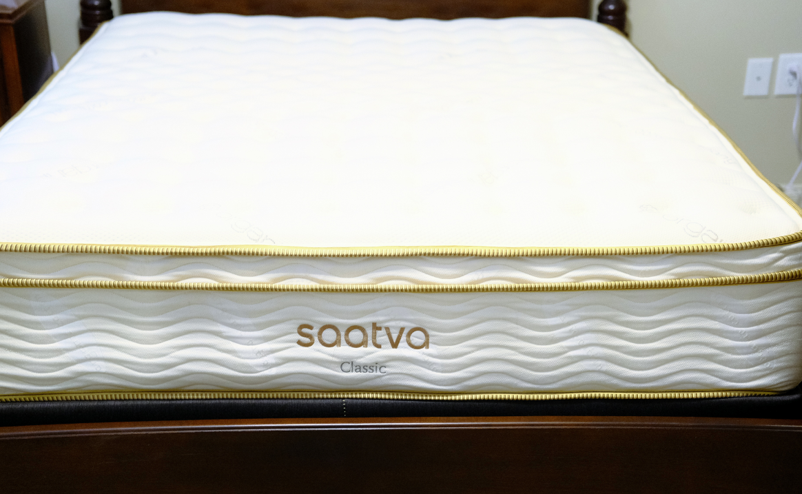 Saatva mattress on bed frame.