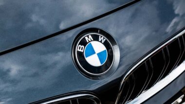 Close up of BMW emblem on a front bumper, representing the BMW recall.