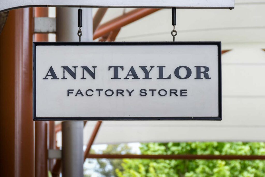 Close up of Ann Taylor Factory Store signage, representing the Ann Taylor and Loft class action.