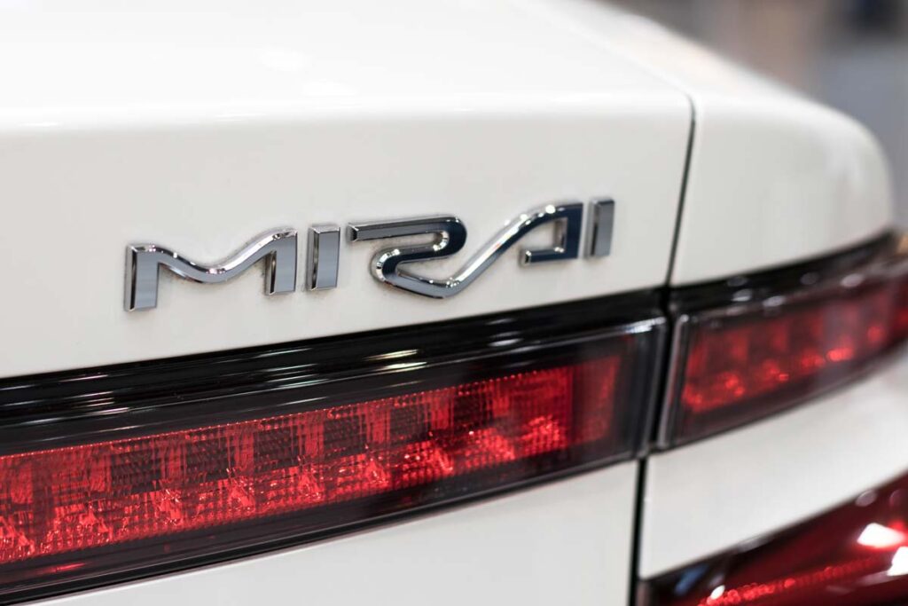 Mirai emblem on the bumper of a Toyota Mirai vehicle, representing the Toyota class action.