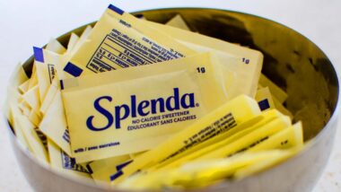 Close up of Splenda packets in a bowl, representing Splenda class action lawsuit.