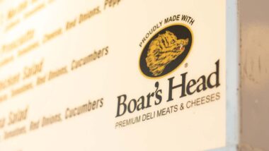 Close up of the Boar's Head logo, representing Boar's head deli meat recall.