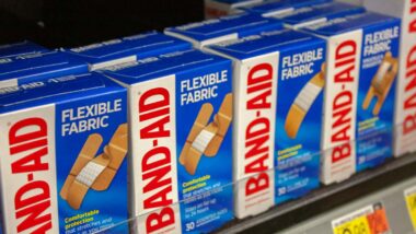 Close up of Johnson & Johnson Band-Aid products on a supermarket shelf, representing the Band-Aid class action.