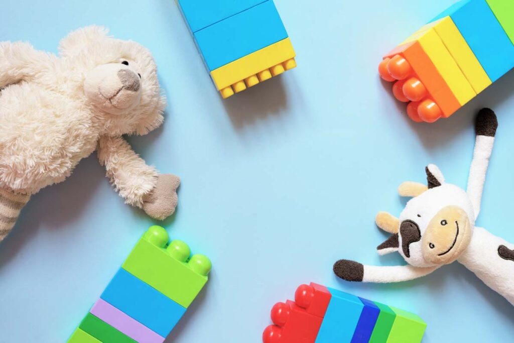 Various toys against a blue backdrop, representing children's recalls and class actions.