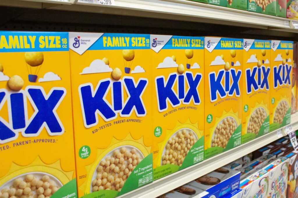 Kix cereal boxes on a supermarket shelf, representing Kix cereal settlement.