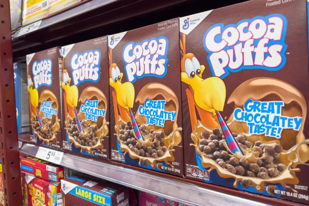 Cocoa Puffs products on a supermarket shelf,