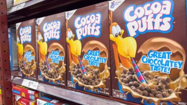 Cocoa Puffs products on a supermarket shelf,