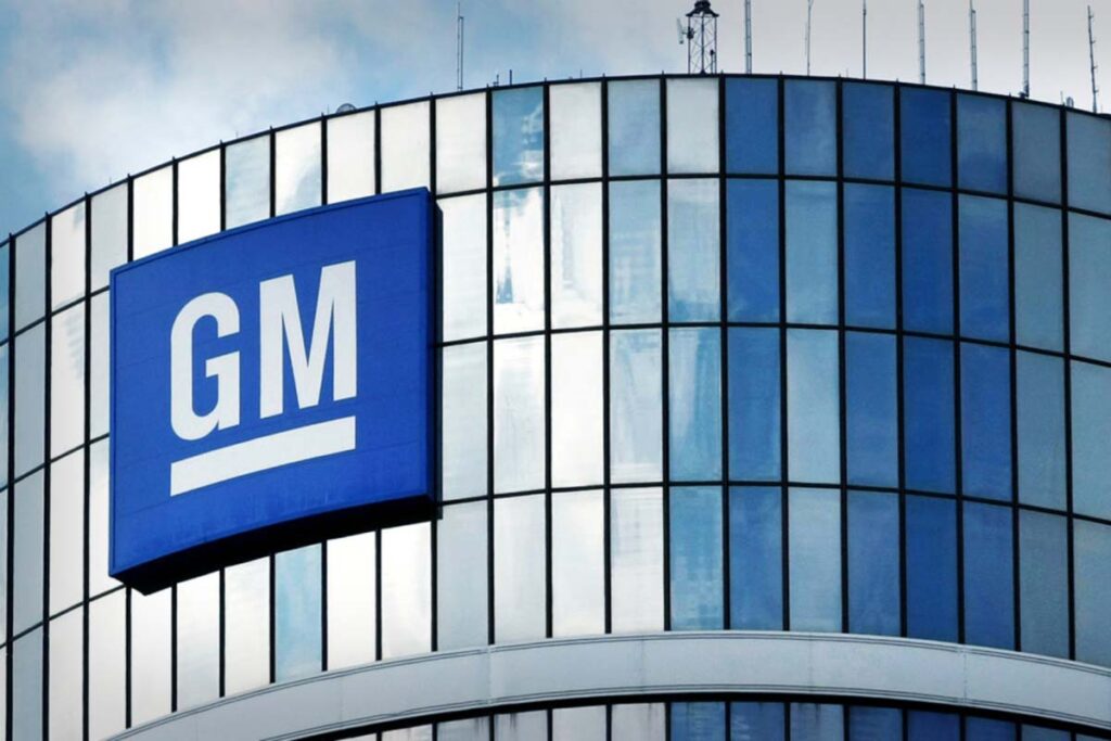 General Motors signage on a building in New York, representing GM class actions and settlements.