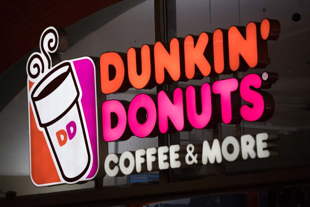 Close up of Dunkin Donuts signage, representing the Dunkin' class action.