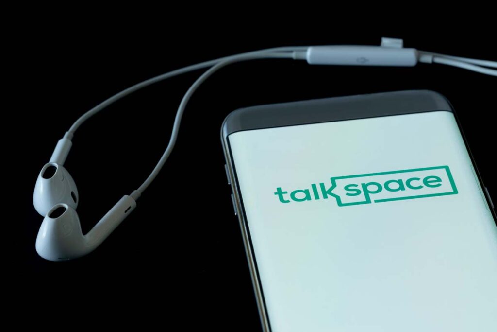 Talkspace logo displayed on a smartphone screen, representing the Talkspace class action.