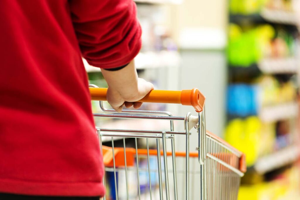 Close up of a woman pushing a shopping cart, representing top recalls for the week of Aug. 19.