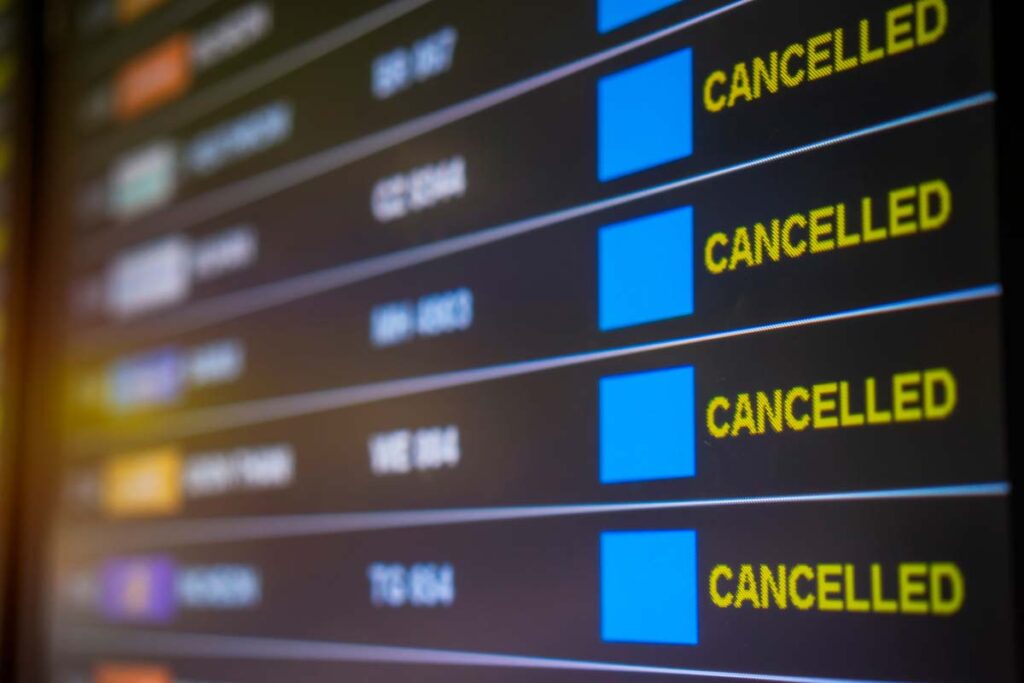 Close up of flight board showing cancelled flights, representing the Crowdstrike lawsuit.