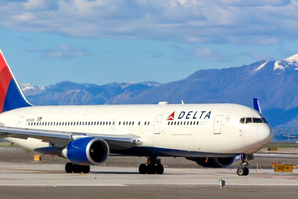 A Delta Airlines plane on the tarmac of an airport, representing the Delta flight cancellation.