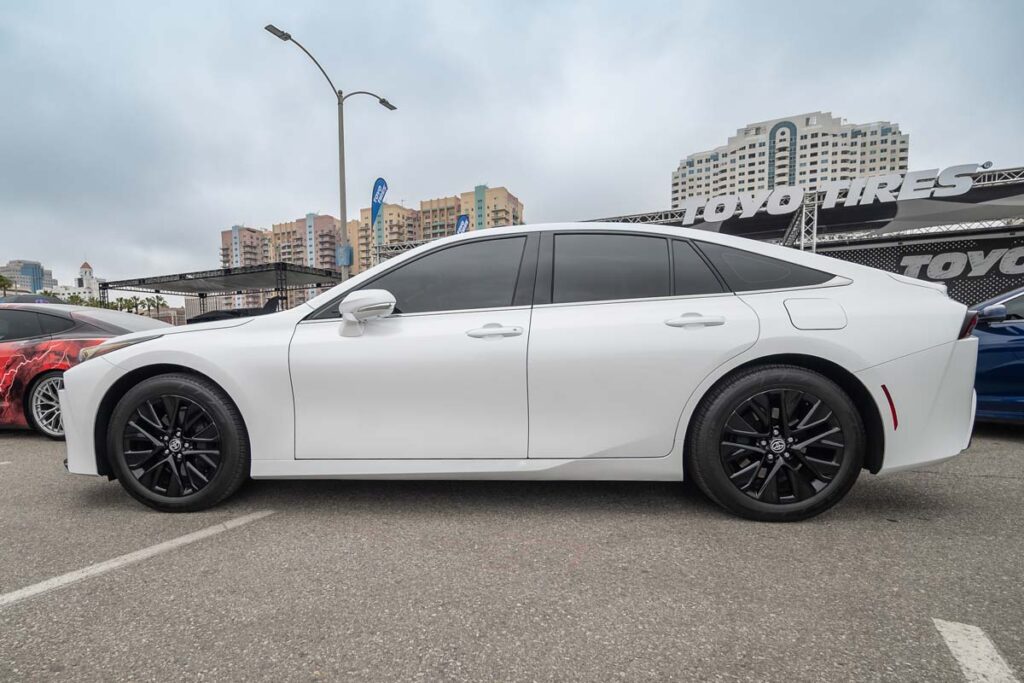 Side view of a Toyota Mirai in a parking lot, representing the Toyota class action.